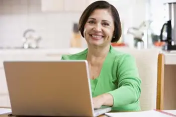 An image of a woman on the computer